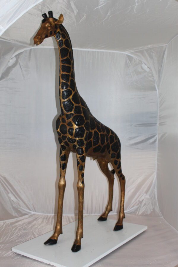 Pair of Giraffes Bronze Statues -  Size: 32"L x 12"W x 55"H.