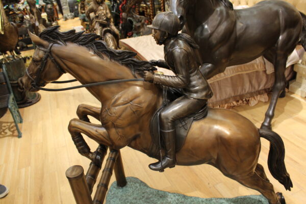 Jockey and Horse Jump a Fence Bronze Statue -  Size: 60"L x 30"W x 51"H.