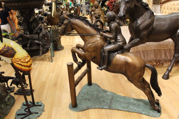 Jockey and Horse Jump a Fence Bronze Statue -  Size: 60"L x 30"W x 51"H.