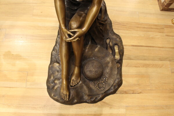 Lady on Stone Bronze Statue -  Size: 33"L x 23"W x 34"H.