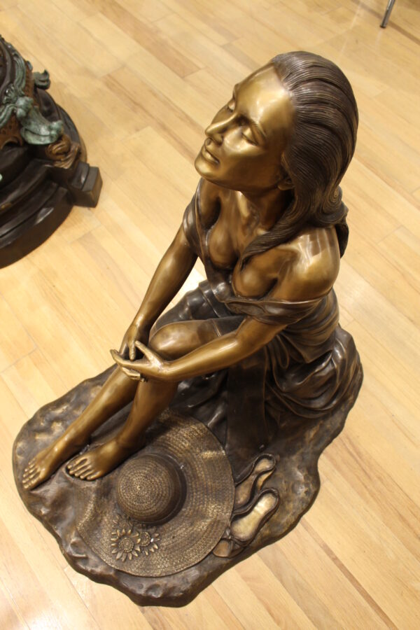 Lady on Stone Bronze Statue -  Size: 33"L x 23"W x 34"H.