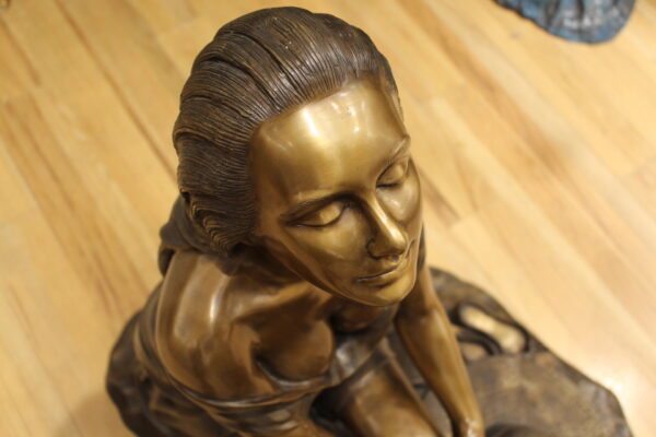 Lady on Stone Bronze Statue -  Size: 33"L x 23"W x 34"H.