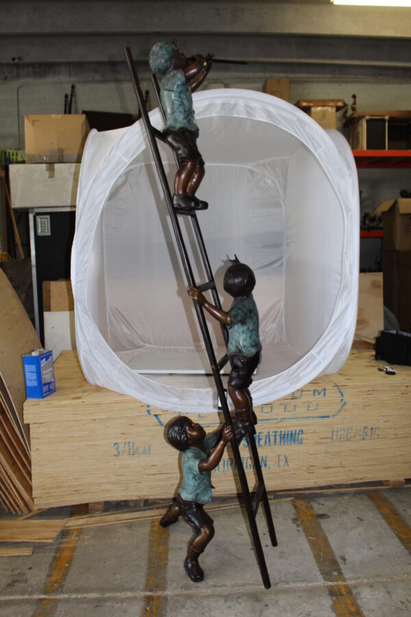 Three kids on a ladder Bronze Statue -  Size: 24"L x 22"W x 94"H.