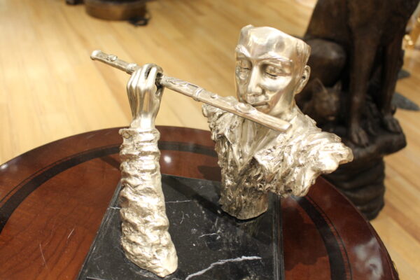 Man playing Flute Bronze Statue -  Size: 10"L x 8"W x 10"H.