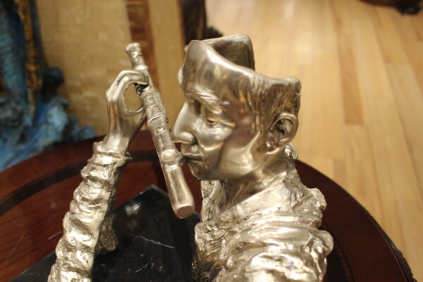 Man playing Flute Bronze Statue -  Size: 10"L x 8"W x 10"H.