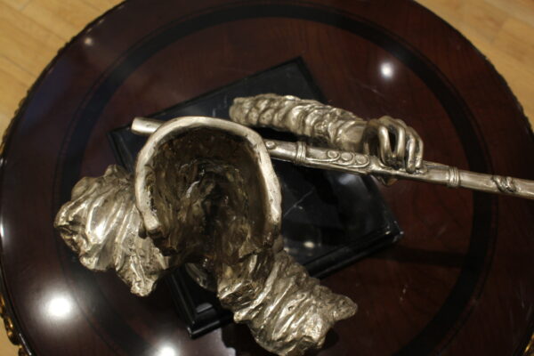 Man playing Flute Bronze Statue -  Size: 10"L x 8"W x 10"H.