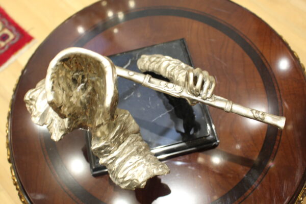 Man playing Flute Bronze Statue -  Size: 10"L x 8"W x 10"H.