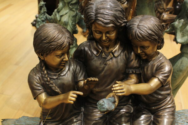 Three Children On Log Holding Bird Bronze Statue -  Size: 55"L x 18"W x 38"H.