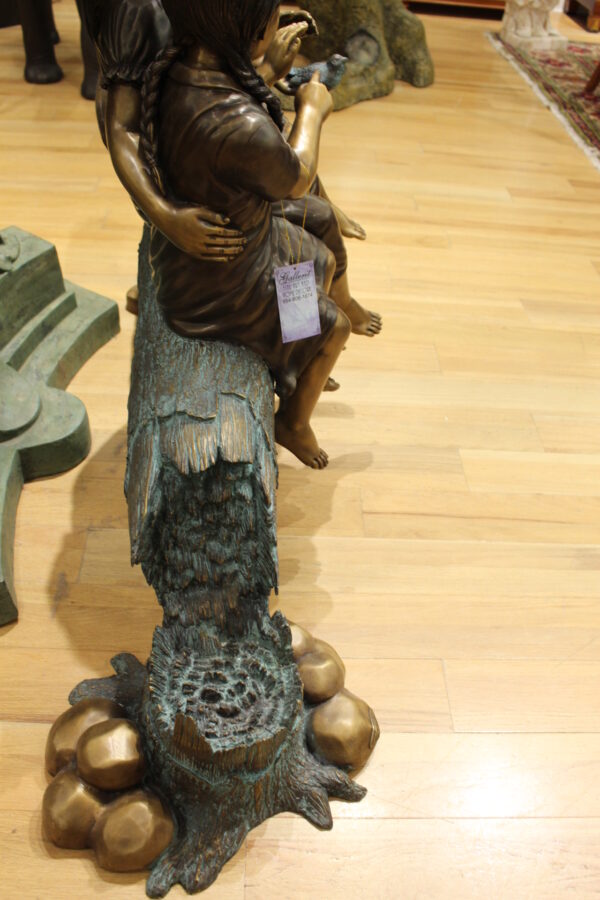 Three Children On Log Holding Bird Bronze Statue -  Size: 55"L x 18"W x 38"H.