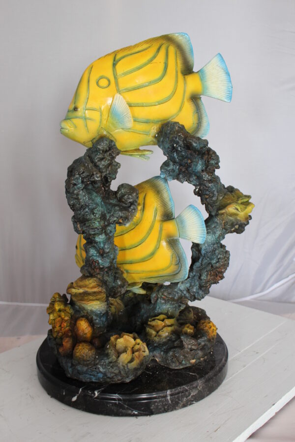 Two Butterfly fish swimming bronze statue -  Size: 12"L x 12"W x 24"H.