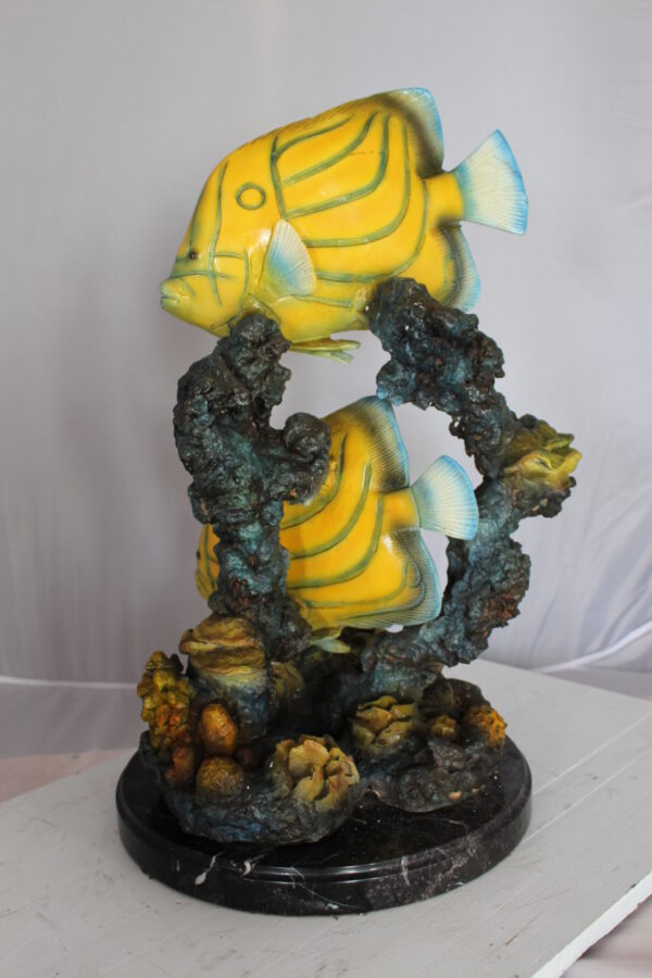 Two Butterfly fish swimming bronze statue -  Size: 12"L x 12"W x 24"H.