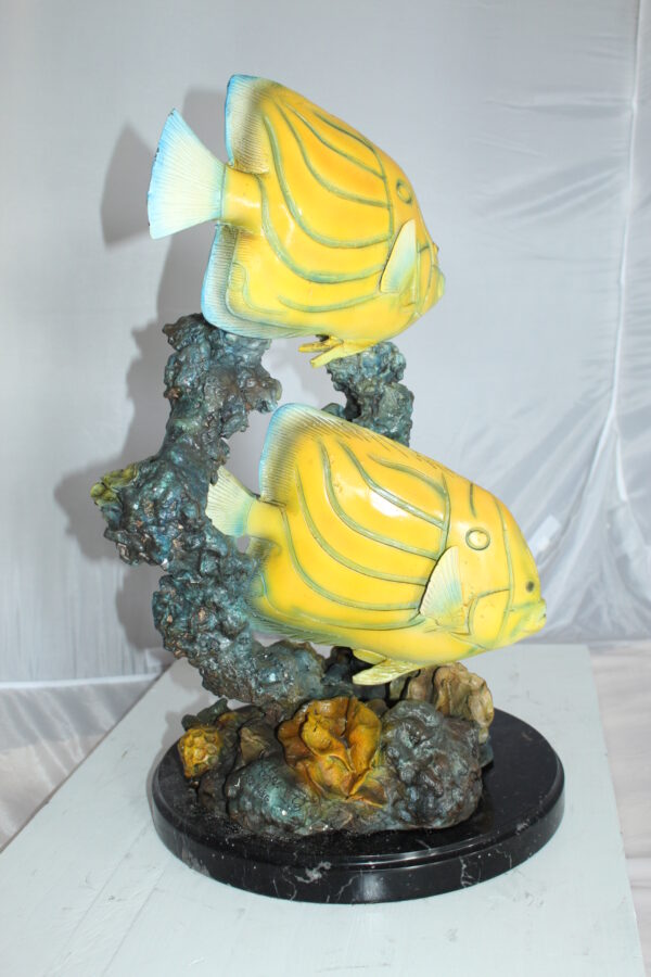 Two Butterfly fish swimming bronze statue -  Size: 12"L x 12"W x 24"H.