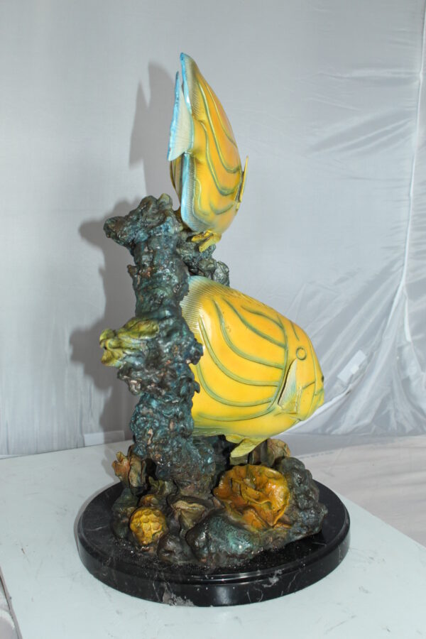 Two Butterfly fish swimming bronze statue -  Size: 12"L x 12"W x 24"H.