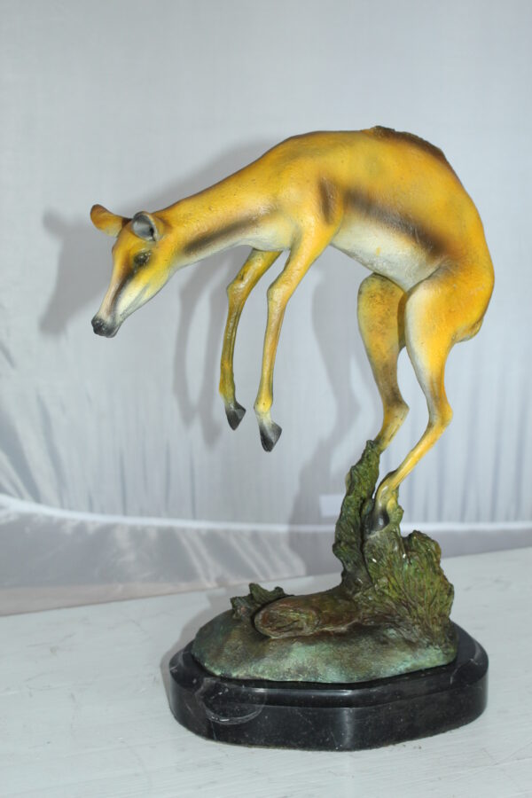 Jumping Impala bronze statue -  Size: 9"L x 7"W x 16"H.