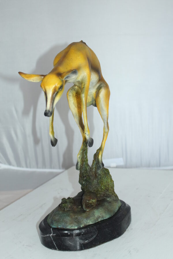 Jumping Impala bronze statue -  Size: 9"L x 7"W x 16"H.
