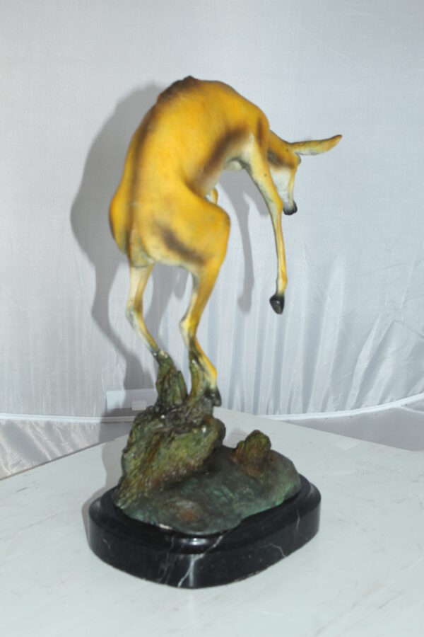 Jumping Impala bronze statue -  Size: 9"L x 7"W x 16"H.