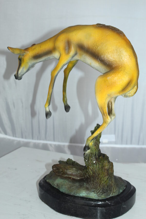 Jumping Impala bronze statue -  Size: 9"L x 7"W x 16"H.