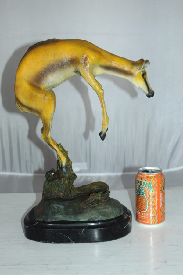 Jumping Impala bronze statue -  Size: 9"L x 7"W x 16"H.