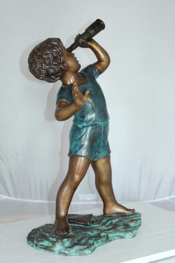 Boy with telescope Bronze Statue -  Size: 14"L x 10"W x 28"H.