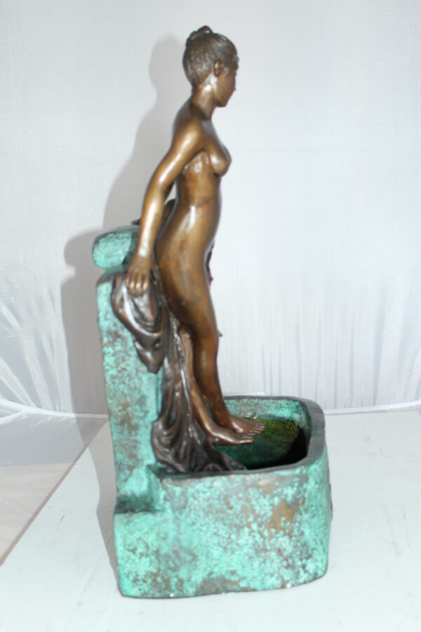 Lady on Wall fountain Bronze Statue -  Size: 12"L x 9"W x 21"H.