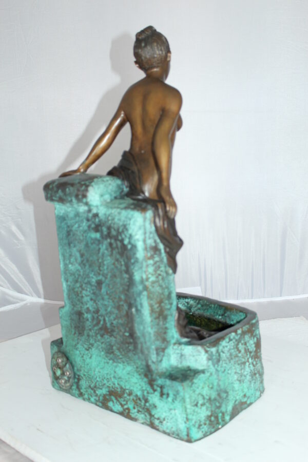 Lady on Wall fountain Bronze Statue -  Size: 12"L x 9"W x 21"H.