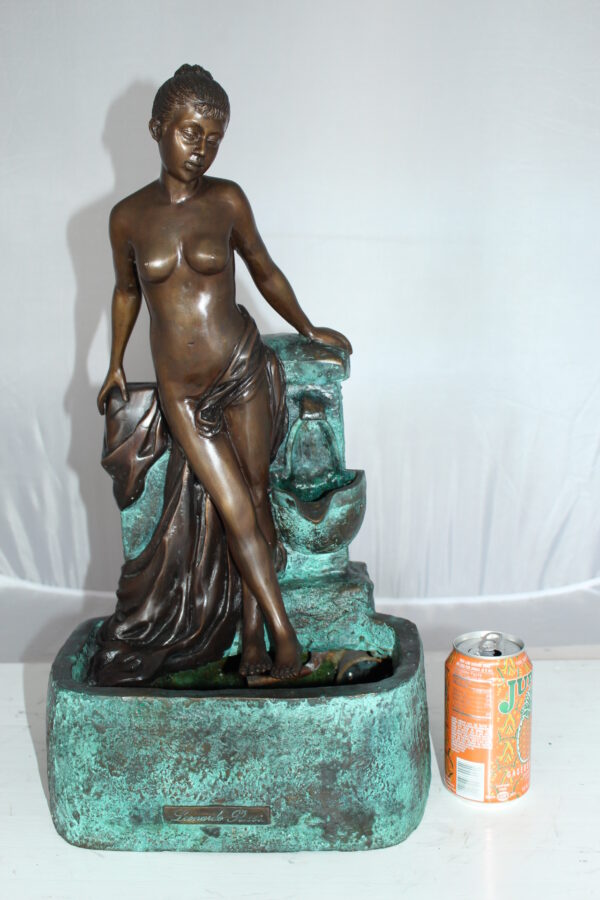 Lady on Wall fountain Bronze Statue -  Size: 12"L x 9"W x 21"H.