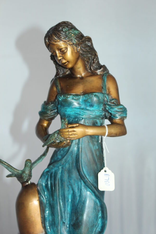 Girl with a Bird Bronze Statue -  Size: 7"L x 7"W x 18"H.