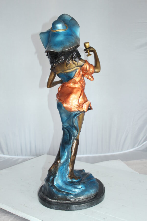 Lady Holding a Wine Glass Bronze Statue -  Size: 9"L x 11"W x 26"H.