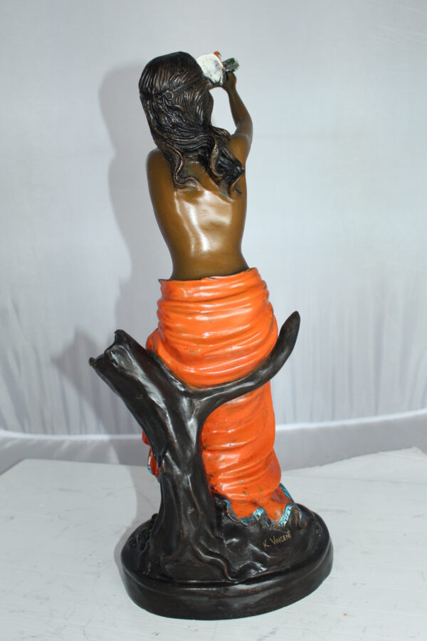 Lady Holds a Bird Up Bronze Statue -  Size: 7"L x 7"W x 20"H.