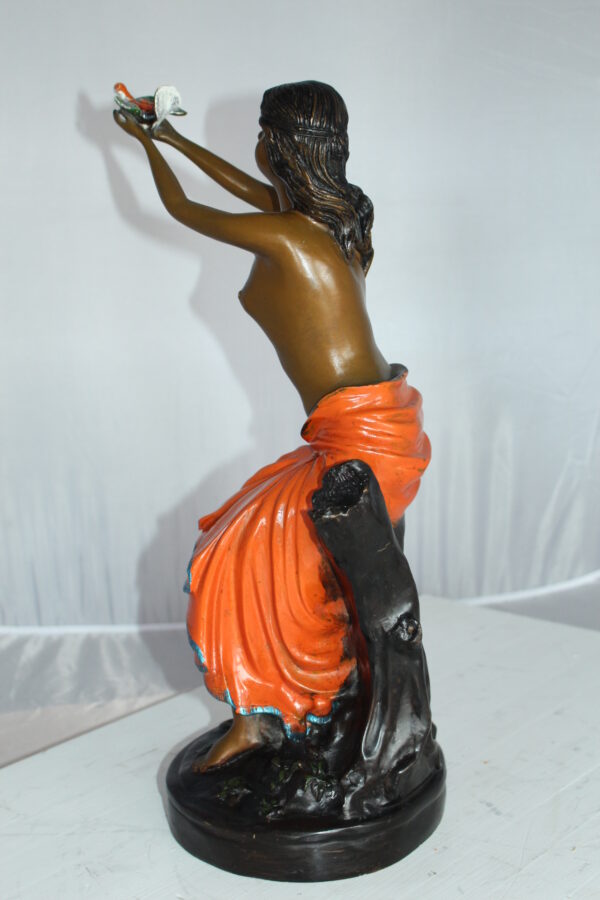 Lady Holds a Bird Up Bronze Statue -  Size: 7"L x 7"W x 20"H.