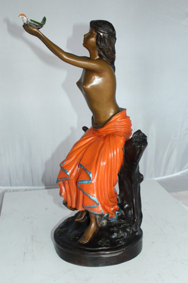 Lady Holds a Bird Up Bronze Statue -  Size: 7"L x 7"W x 20"H.