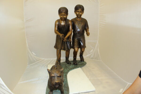 Two Kids Walking a dog Bronze Statue -  Size: 55"L x 28"W x 37"H.