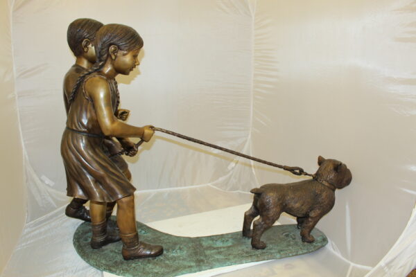 Two Kids Walking a dog Bronze Statue -  Size: 55"L x 28"W x 37"H.