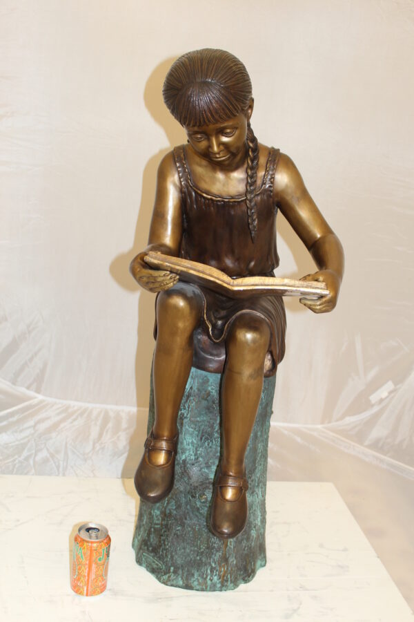 Girl Sitting on a Tree Stump Reading a Book Bronze Statue -  15"L x 17"W x 38"H