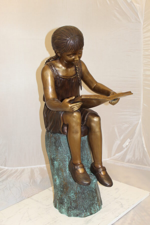 Girl Sitting on a Tree Stump Reading a Book Bronze Statue -  15"L x 17"W x 38"H