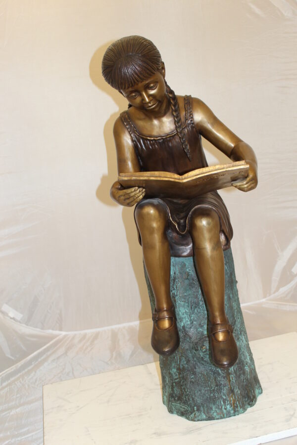 Girl Sitting on a Tree Stump Reading a Book Bronze Statue -  15"L x 17"W x 38"H