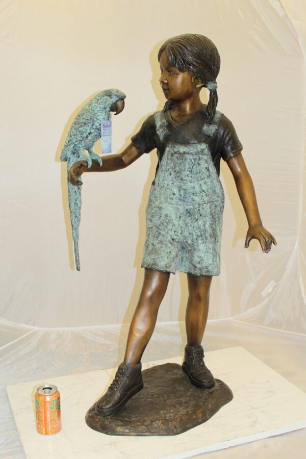 Girl Holding a Parrot Bronze Statue -  Size: 26"L x 19"W x 42"H.