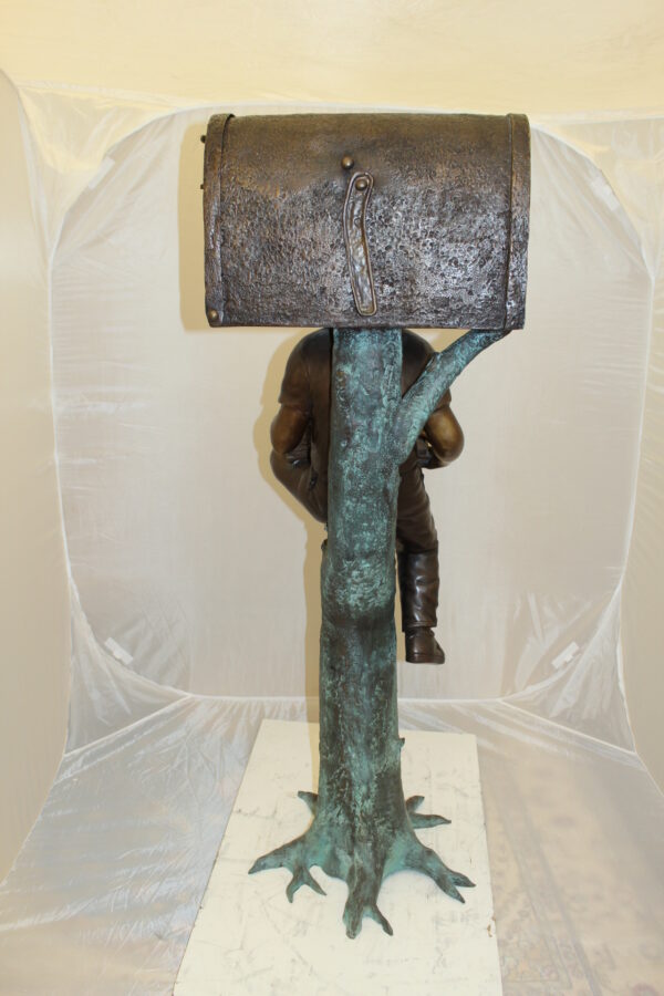 Boy Sitting by a Mailbox reading a book Bronze Statue -  16"L x 20"W x 50"H.