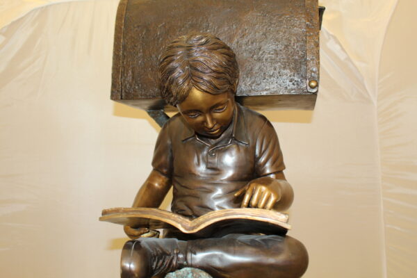 Boy Sitting by a Mailbox reading a book Bronze Statue -  16"L x 20"W x 50"H.