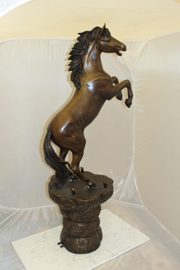 Horse on a Rock Fountain Bronze Statue -  Size: 20"L x 18"W x 56"H.
