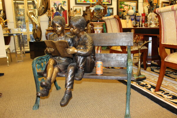 Kids Reading a Book on a Bench Bronze Statue -  Size: 23"L x 38"W x 37"H.