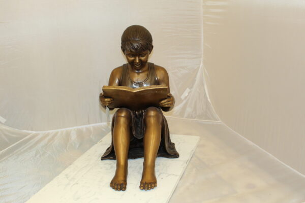 Girl Sitting and Reading a Book Bronze Statue -  Size: 23"L x 15"W x 24"H.