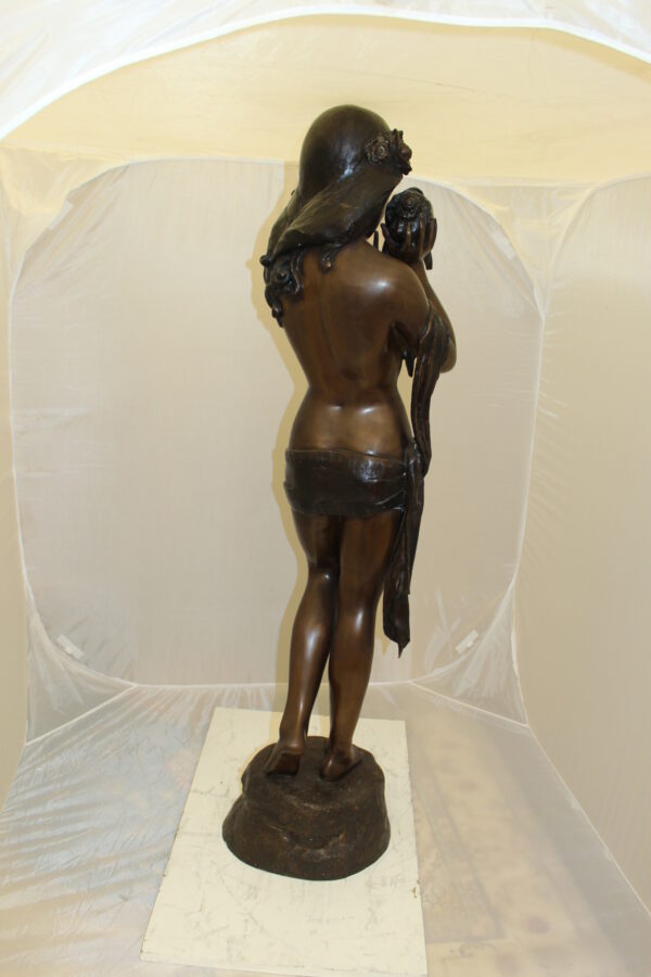 Girl Holding a Sea Shell Bronze Statue -  Size: 13"L x 14"W x 57"H.