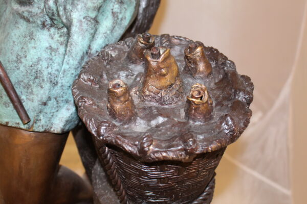 Boy Sitting on a Tree and Fishing Bronze Statue -  Size: 36"L x 21"W x 37"H.