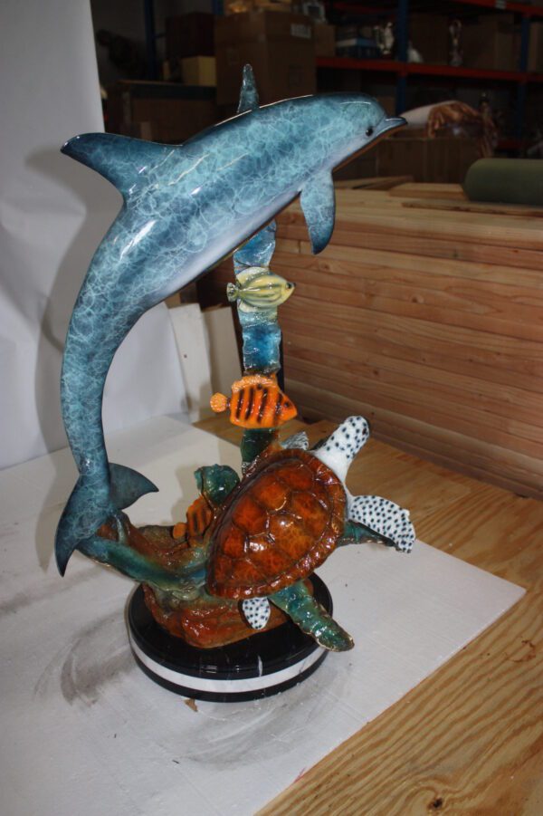 Dolphin with two fish and one turtle Statue -  Size: 22"L x 12"W x 32"H.