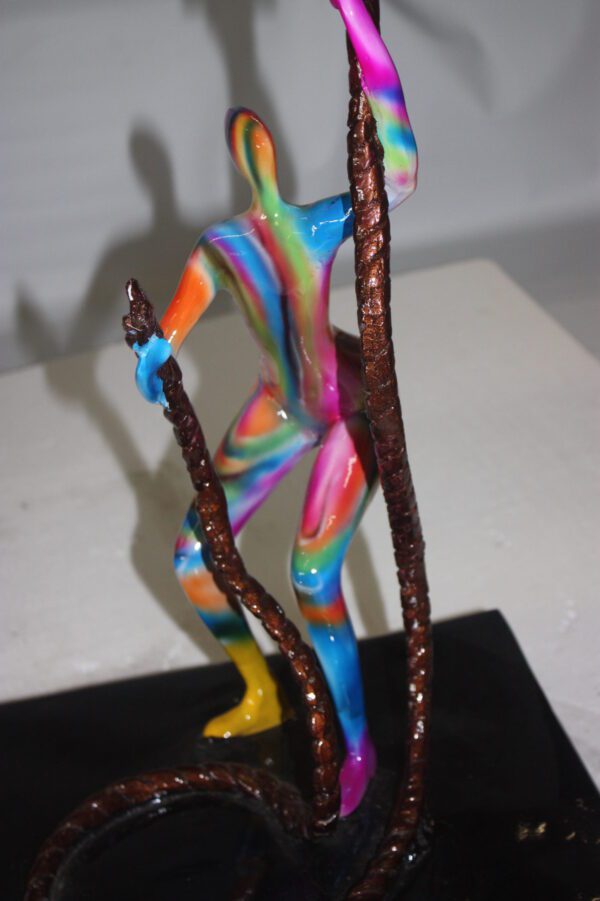 Two boys made of Bronze climbing on rope -  Size: 14"L x 14"W x 39"H.