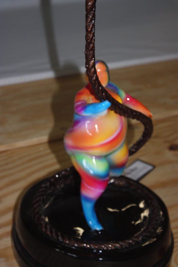 Two fat ladies made of Bronze climbing on rope -  Size: 10"L x 10"W x 31"H.