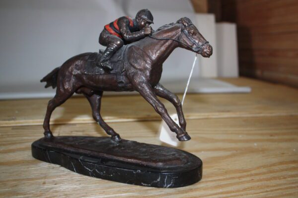 Jockey on horse - Bronze Statue -  Size: 11"L x 4"W x 8"H.