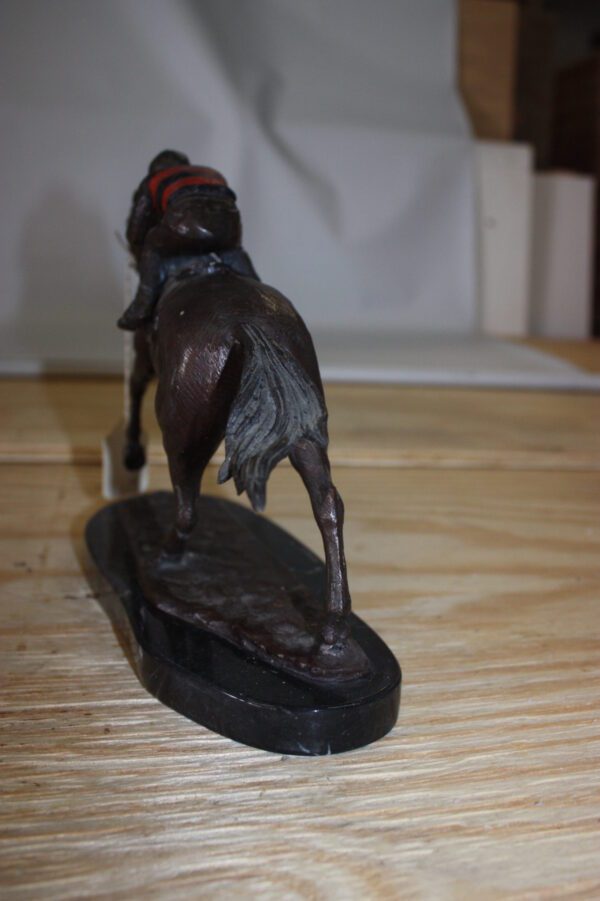 Jockey on horse - Bronze Statue -  Size: 11"L x 4"W x 8"H.