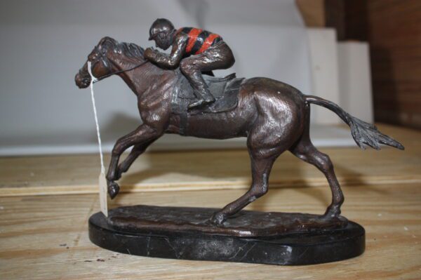 Jockey on horse - Bronze Statue -  Size: 11"L x 4"W x 8"H.